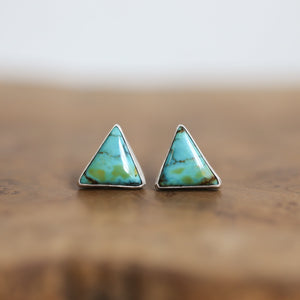 May include: Two triangular turquoise earrings with silver settings